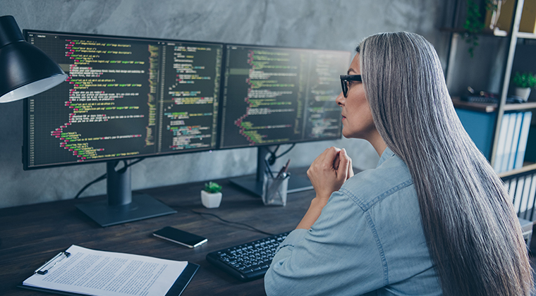 Female engineer works on coding an applicant tracking system