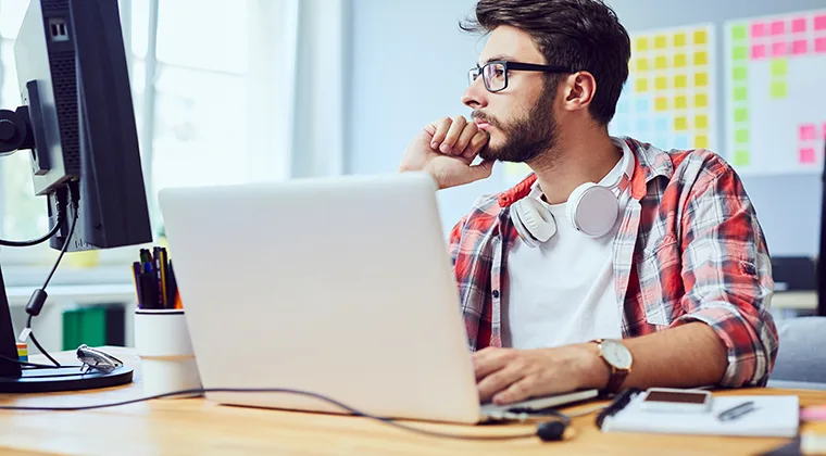 Man thinking over computer