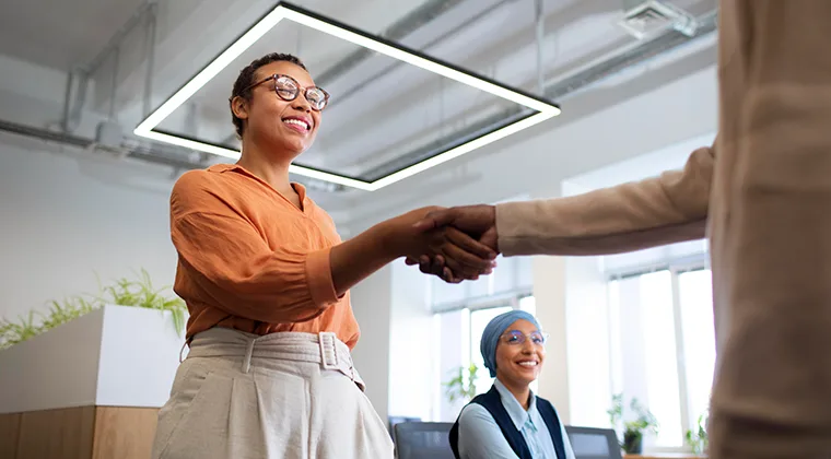 woman shaking a hand