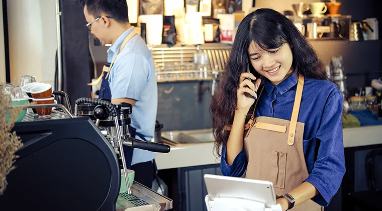 coffee shop owner on phone